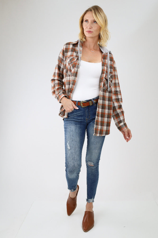 Brown plaid flannel shirt with jeans and mules