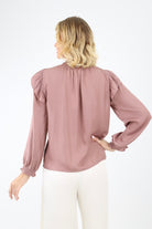 Back of lilac smocked blouse