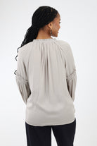 Back of gray satin sleeve blouse