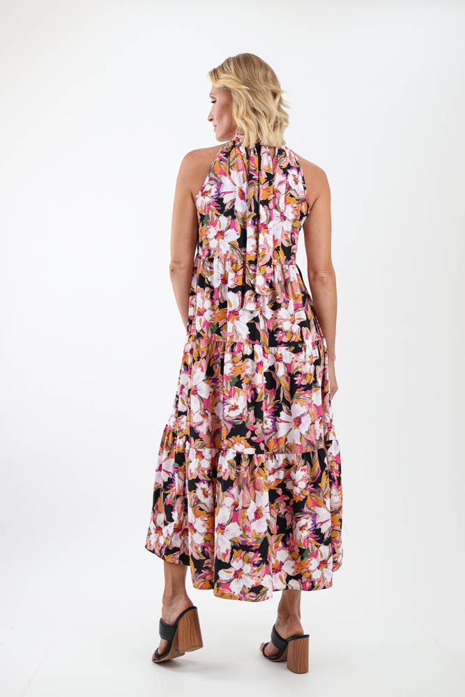 Back of black floral halter tie back dress