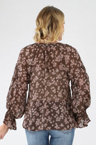 Back of semi sheer brown Floral Ruffle Blouse