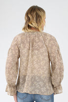 Back of semi sheer beige Floral Ruffle Blouse