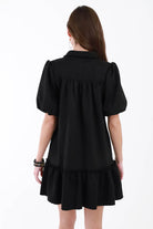 Back of black ribbed sweater dress