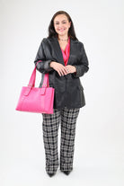 Faux Leather Blazer paired with checkered pants, a fuchsia blouse, and a fuchsia blouse